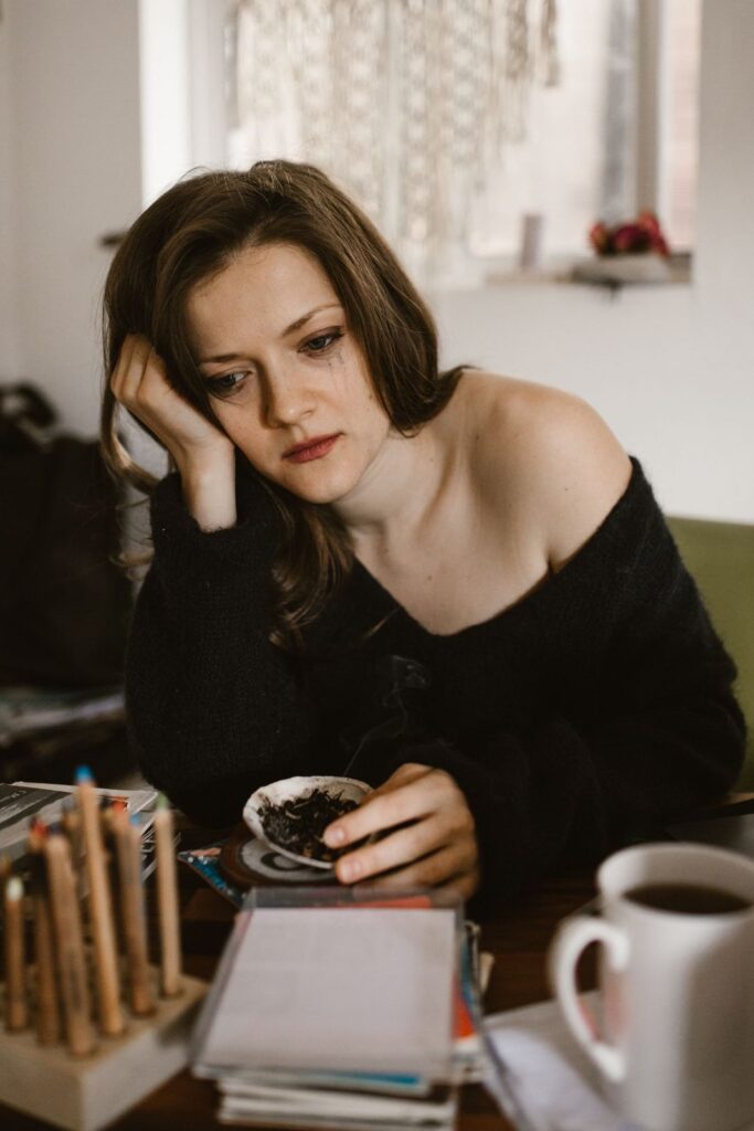Woman sitting at a table looking worried