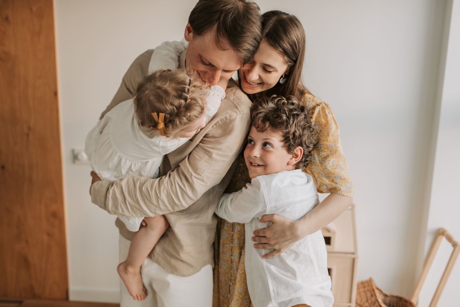 Family hugging at home