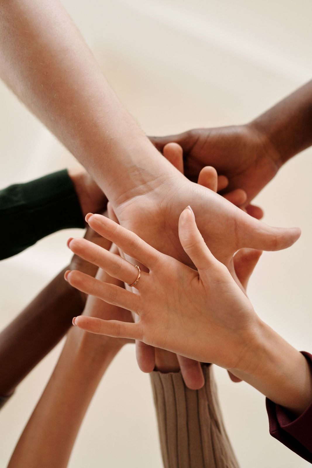 Hands joined together in support