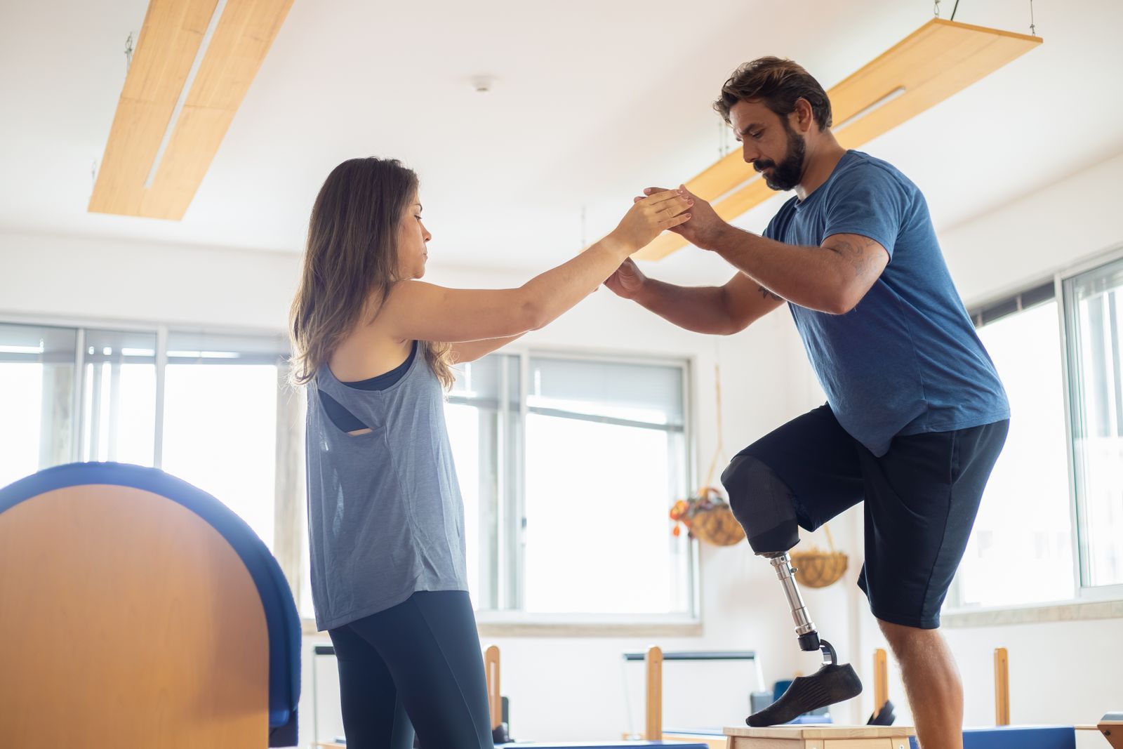 Physical therapist guiding a patient through a balance exercise