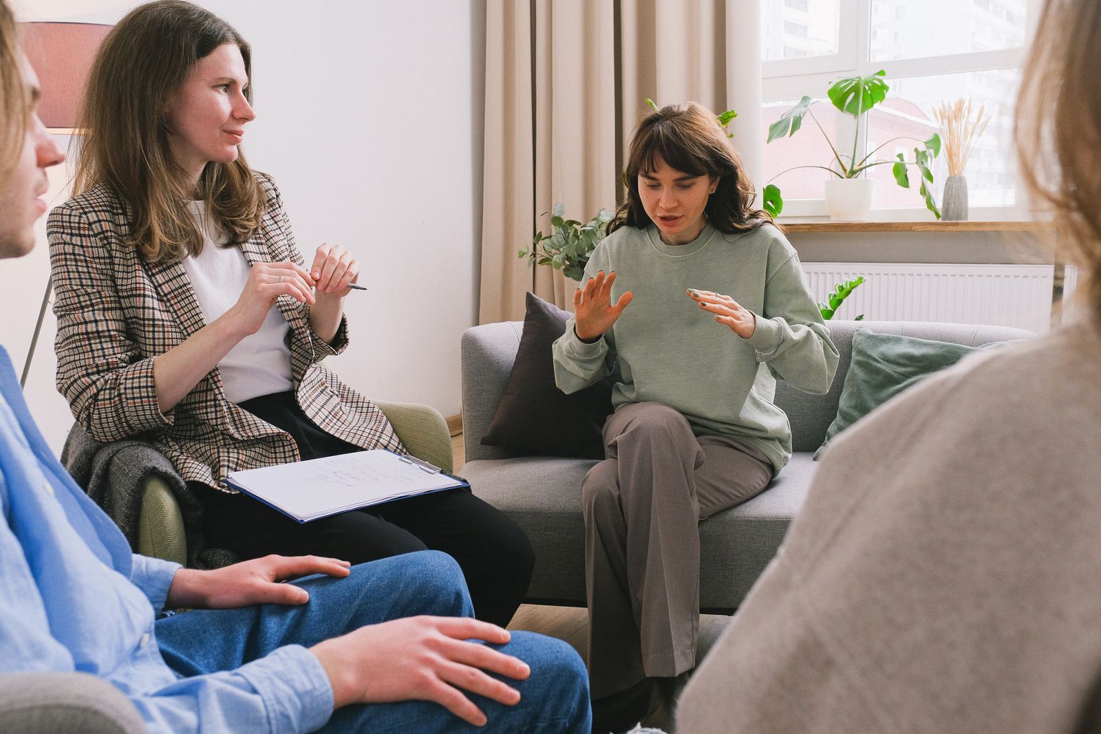 Therapist leading a calm counseling session in a bright room