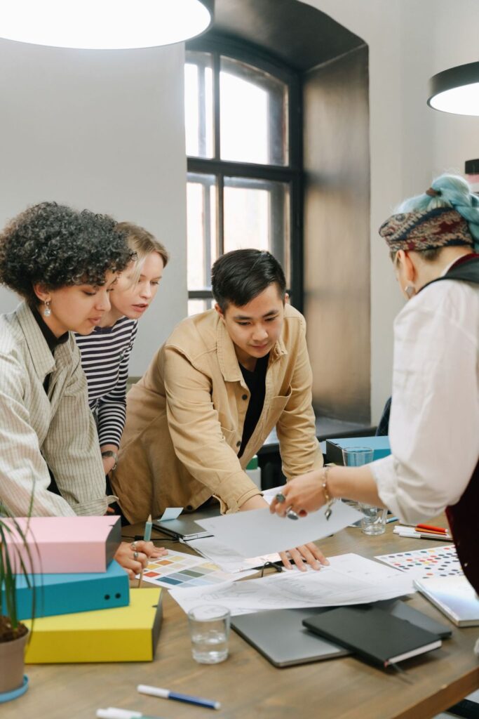 Adults working together in a psychosocial rehabilitation group activity