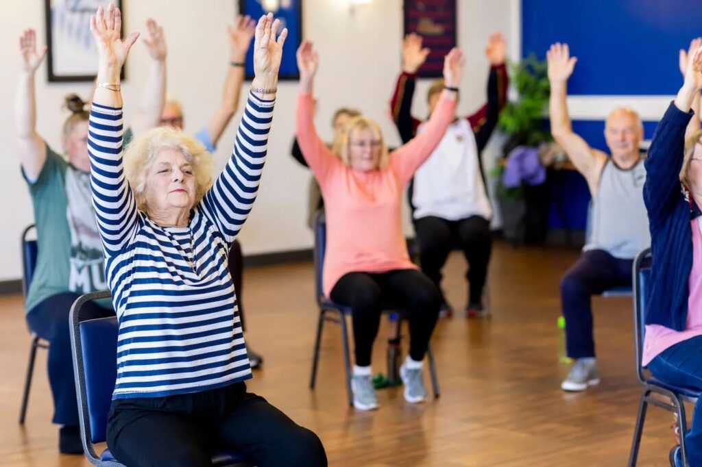Older adults doing rehabilitation exercises in a group
